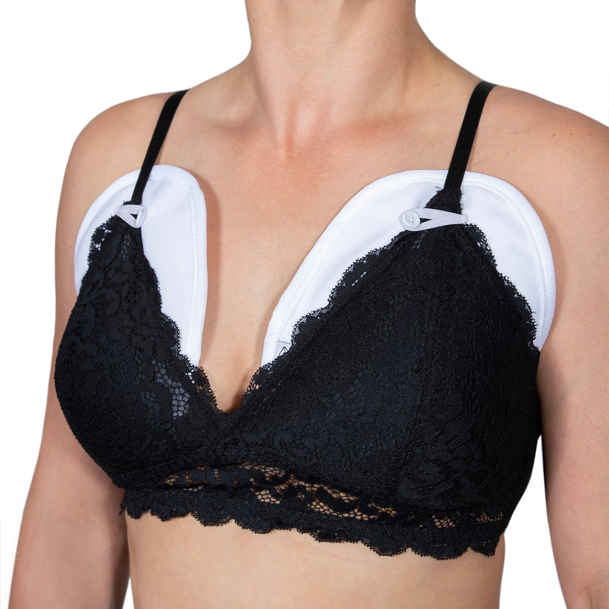 Castor oil for breast health organic wraps worn over a black lace bra for breast tissue support and nourishment.