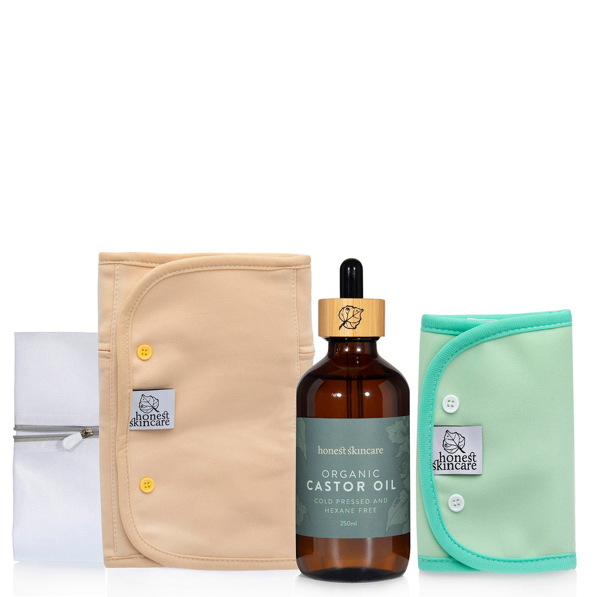 Organic castor oil bottle with a beige waist wrap, green joint wrap and a wash bag on a white background