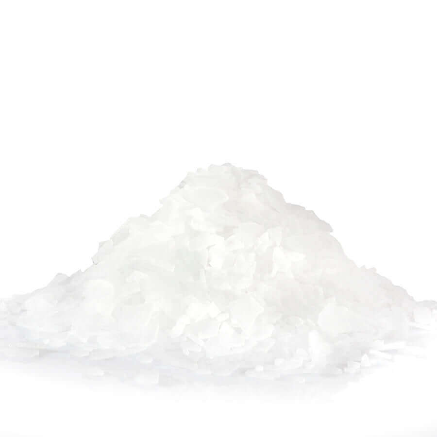 Magnesium for muscle recovery: a pile of pure magnesium chloride flakes for bath relaxation.