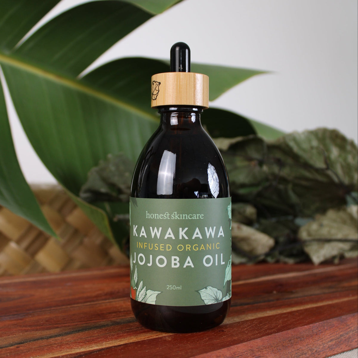 Kawakawa Jojoba Oil for Skin - Organic product in a glass bottle with wooden cap, showcasing natural skincare benefits.