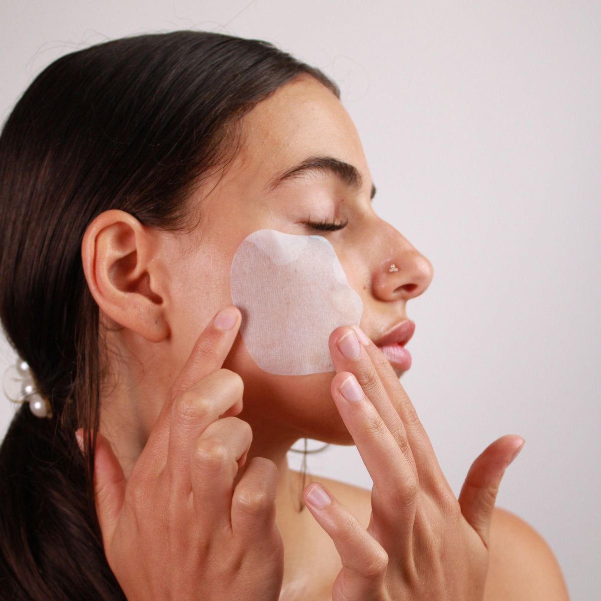 woman using melting best collagen mask skincare on check