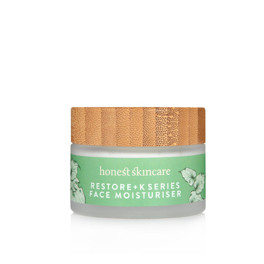Hydrating facial cream in a jar with a bamboo lid by Honest Skincare, labeled Restore+ K Series Face Moisturiser.