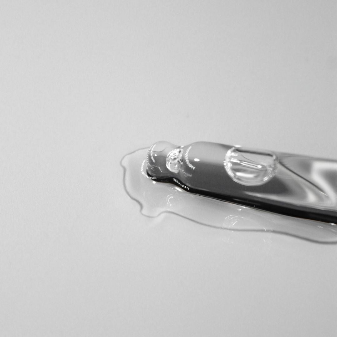 Close-up of organic castor oil droplet on a surface, showcasing its pure and nourishing qualities.