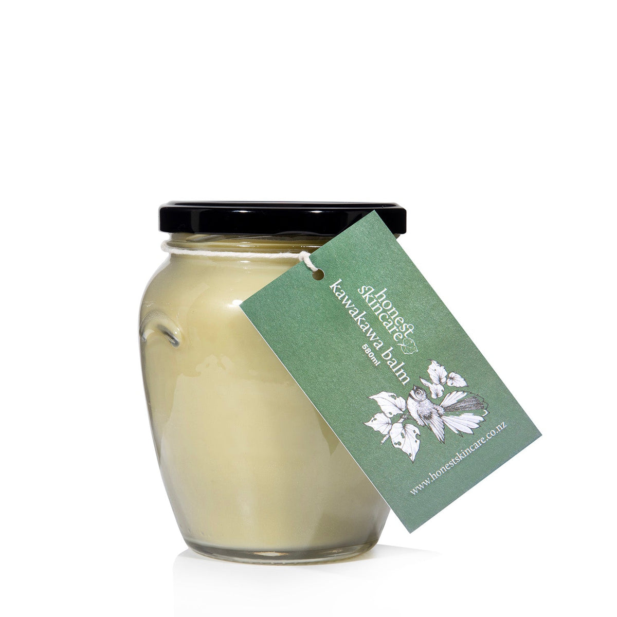 Kawakawa balm in a glass jar with a black lid and a green label, designed to soothe and protect sensitive skin.