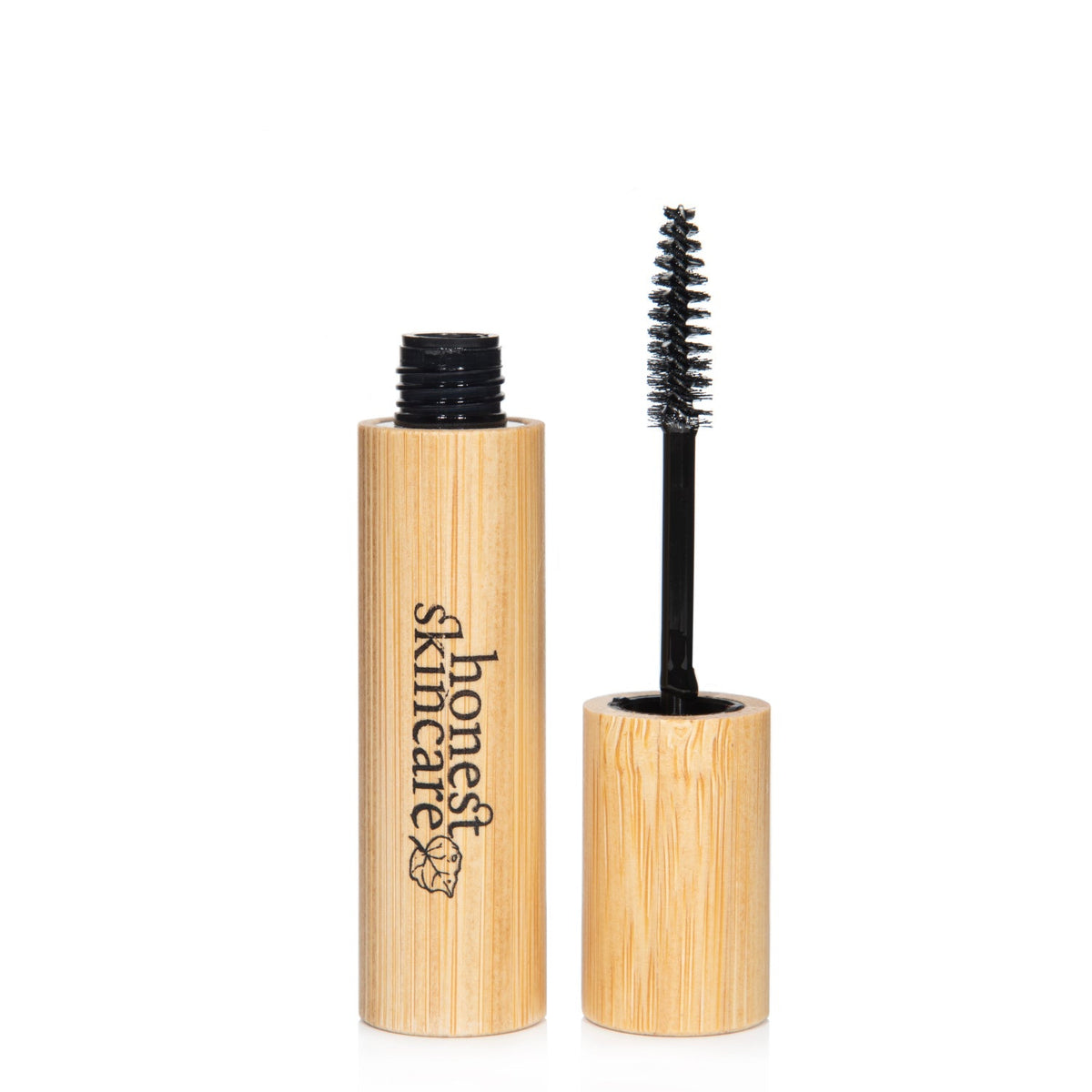Castor oil for eyelashes in an eco-friendly bamboo container with a brush for easy application.