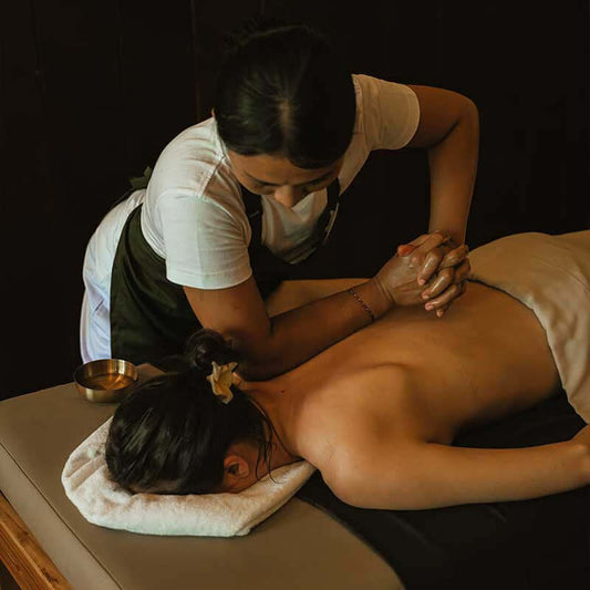 Balinese massage at Akaea Spa Rarotonga, showcasing a therapist performing a full-body treatment on a client.